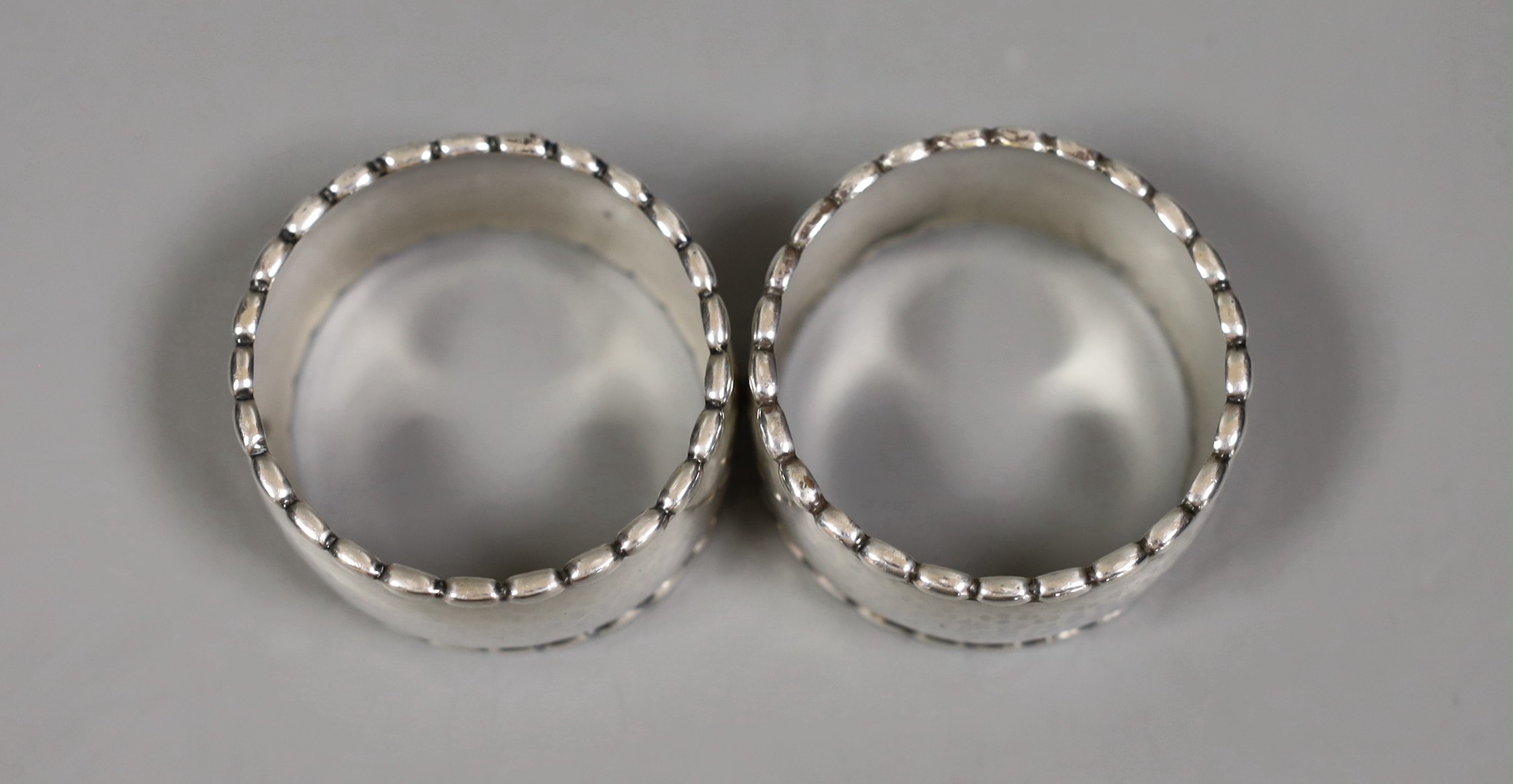A pair of Georg Jensen sterling napkin rings, numbered 30D, 54mm.